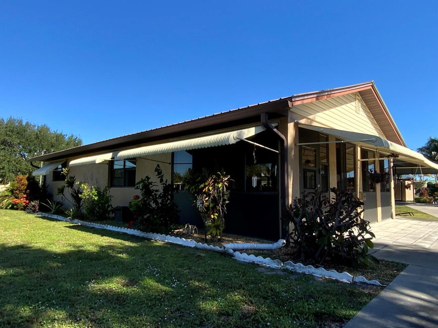 Unique multi-family zoned canalfront property featuring a separate guest home--ideal for family, guests, or rental income! Enjoy 90' of seawall, private boat ramp, and quick access to Lake Okeechobee through the nearby lock. Both homes are concrete block with metal roofs and in great condition--ready to move in! A 12' carport provides plenty of room for your boat, RV, or side-by-side. Just a short golf cart ride to private clubs and the general store. Bring your fishing pole--this one has it all!