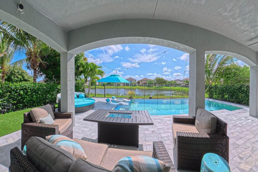 Stunning 4-bedroom, 4-bathroom home featuring high-end upgrades and a spacious open floor plan perfect for entertaining. Enjoy luxury vinyl plank (LVP) flooring throughout, LED lighting, crown molding, and custom plantation shutters.The kitchen boasts a gourmet stainless steel range featuring a double oven. The home offers custom closet shelving with automatic lighting in walk-in closets, bathrooms, and the laundry room, along with beautifully updated glass showers in every bathroom. Additional highlights include a Tesla charger and custom garage shelving, a low-maintenance backyard with premium artificial turf, and HOA-maintained lawn and common areas. Relax in your private outdoor oasis with a heated/chilled pool highlighted by its water features, travertine tile deck, sunshelf with lounge chairs, and a Sonos outdoor speaker system wired underground. An upgraded security system with cameras and Ring doorbell provides added peace of mind. All bedrooms feature walk-in closets, and the home is perfectly positioned to capture serene lake views. Located in the quite gated community of Silverwood Estates which boasts of many green spaces, parks, community pool and playground.  Close to top schools, shopping, and entertainment.