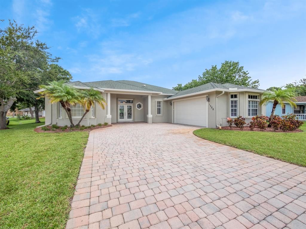 Photo of 1588 SE Flintlock Road, Port St Lucie, FL 34952 (MLS # R10899020)