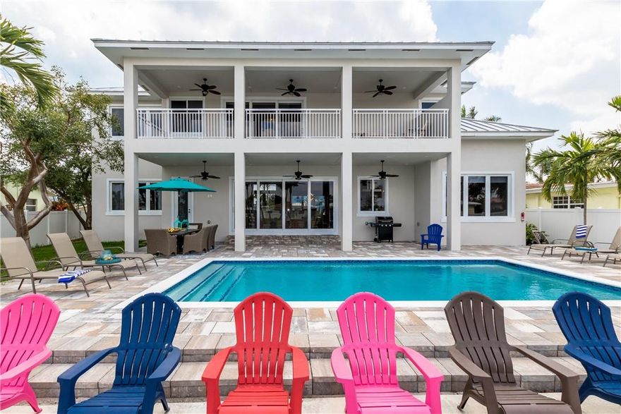 Newly built waterfront property comes fully furnished. This spectacular 5 bedroom home is located off Broward's northern Intracoastal within minutes of the Atlantic Ocean. Stone paved driveway and rear deck complemented by a heated pool and a 60 foot dock. This beauty comes fully furnished with contemporary designs and captivating views that illuminate through the open floor plan. Quartz and marble kitchen with floor-to-ceiling wood cabinetry, brass hardware and a 15 foot island. The master bedroom is designed for comfort with motorized blinds, 3 panel sliding doors and an over-sized balcony overlooking the waterway. This is a true turn-key luxury home.