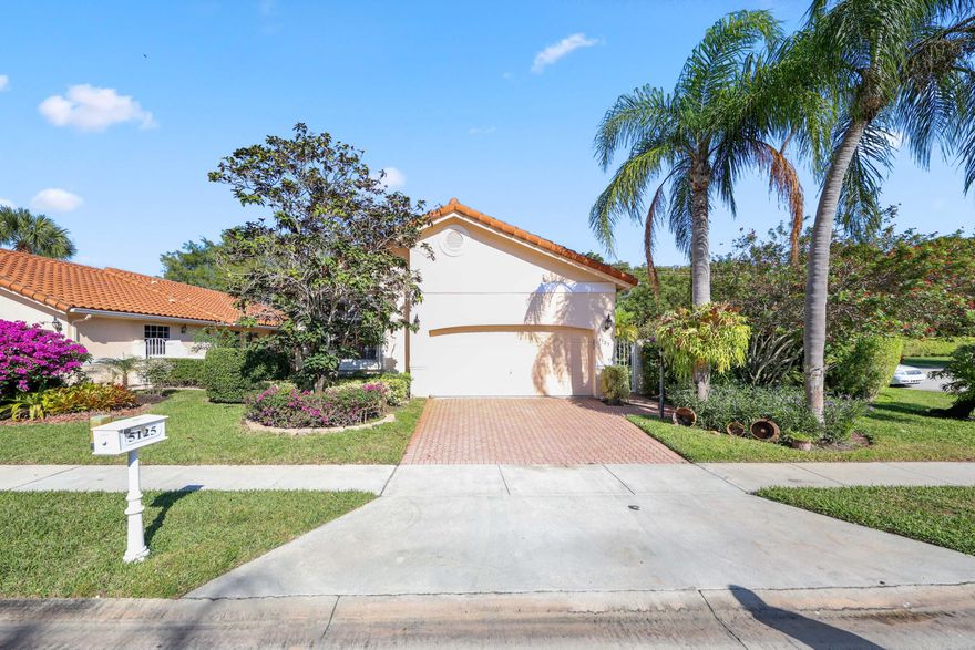 One of Bel-Aire's largest lots, this single-story cul-de-sac home is wrapped in tropical landscaping for a no-visible-neighbor backdrop. On the Boca-Delray border, you're minutes to Downtown Delray and The Ave, with easy access to the beach. Inside, soaring ceilings and an open plan connect the great room, eat-in kitchen, and family room, with split bedrooms for separation. Great room, kitchen, and primary suite open to an oversized covered, screened porch built to hurricane standards with travertine—made for outdoor dining and relaxing. Primary suite offers dual closets, a Roman tub, and separate shower. Gated, all-ages amenities include clubhouse, fitness center, sauna, pool, and tennis. Nearby schools include A-rated middle and high options, plus an A-rated elementary Choice option. This home's outdoor setup is a standout. The oversized covered, screened porch feels like a true extension of the interiorspace for a full dining table, seating areas, and everyday relaxingwhile staying connected to the great room, kitchen, and primary suite. Travertine flooring and hurricane-standard construction make it a place you'll want to use often.

Inside, the single-story layout lives beautifully: high ceilings, an open flow that keeps the kitchen at the center of it all, and a family room that offers a second gathering space beyond the great room. The split-bedroom plan creates separation, and the primary suite is generously sized with dual closets and a bath featuring a Roman tub and separate shower.

Bel-Aire adds a strong lifestyle layer with a gated entrance plus amenities including a clubhouse, fitness center, sauna, pool, and tennis courts. The location also supports top-rated school options, including A-rated middle and high schools in the area, along with an A-rated elementary Choice option.