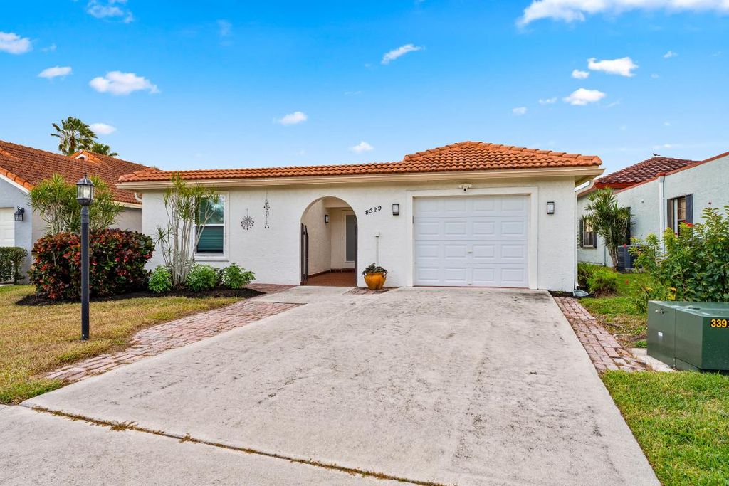Photo of 8329 Bonita Isle Drive, Lake Worth, FL 33467 (MLS # R11152900)