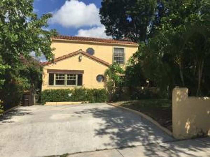 ** Seller is making repairs to upstairs bedroom ceiling. **Spectacular historic charm built 1926 with old Palm Beach flair, walk up to iron gates then pecky cypress doors with extensive use of pecky decor throughout, fireplaces add welcoming warm ambiance all year, beautiful wooden floors lead right up to the wooden staircase with an open loft landing, covered patio with arched wall, fruit trees and paver walking path, lush indigenous florida landscaping makes your tropical paradise complete, all appliances drapes and window treatments will stay to maintain the charm for you, just add furniture and begin your new chapter in magical historic Northwood!