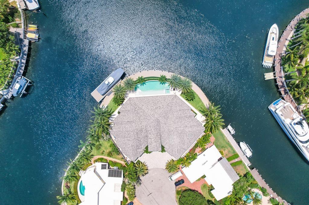 Ultimate luxury in this stunning contemporary Lighthouse Point Home. A Yachtsmans dream With 243 Feet of deep water only Minutes from Hillsboro Inlet. Incredible views from every room, custom wood flooring, high impact hurricane glass, Wolf and subzero appliances, Crestron and Sonos electronics throughout, custom design in every room, natural gas generator, large lap pool, huge covered Summer Kitchen with grill, expansive covered patio for outdoor living and a No profile 90,000lb boat lift. Furniture and decor negotiable