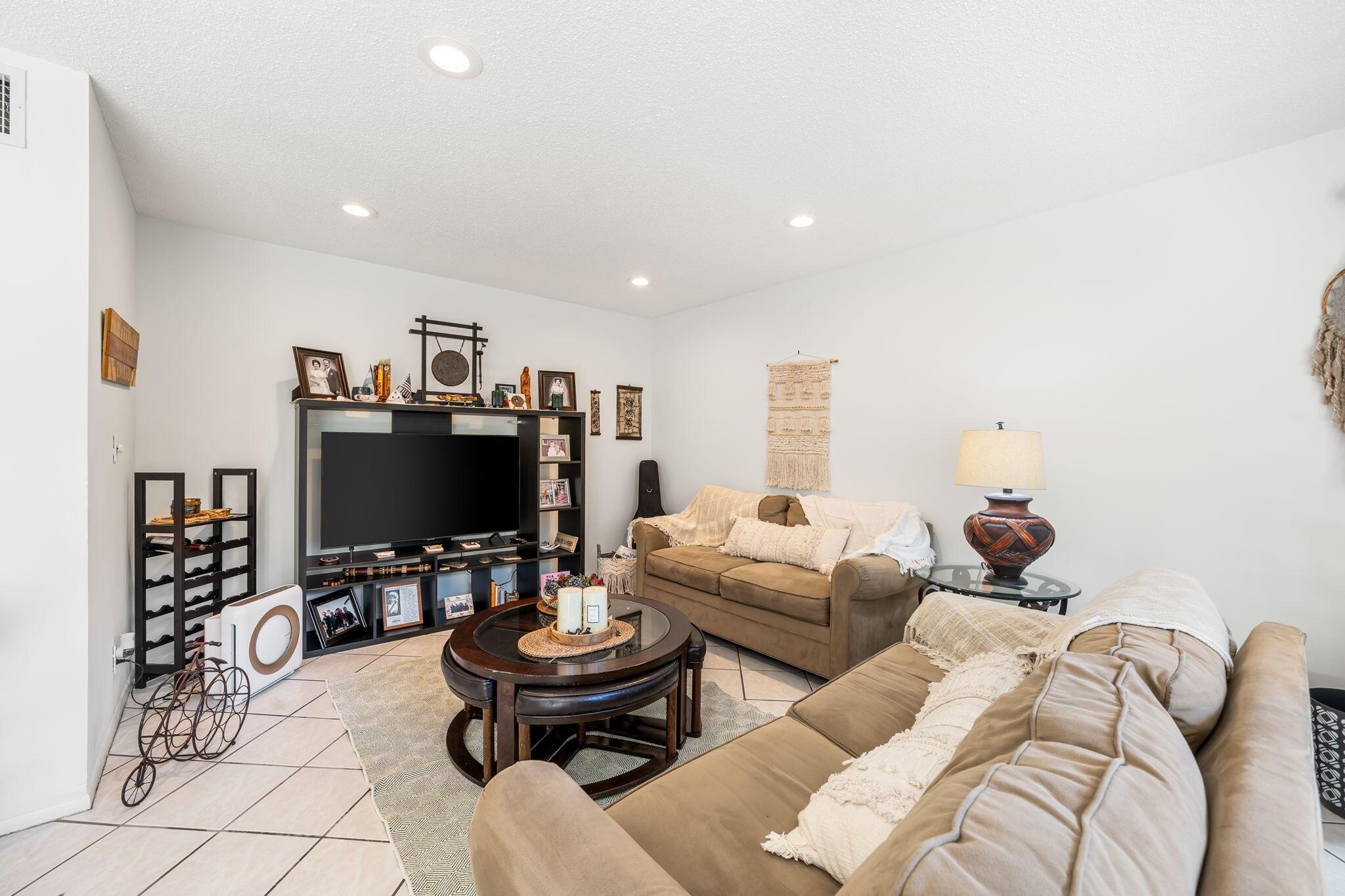**All ages community** Enjoy the ease of first-floor living in this beautifully updated 1-bedroom, 1.5-bath condo located in the heart of Royal Palm Beach. This bright and spacious unit features tile flooring throughout, a remodeled kitchen with granite countertops and stainless steel appliances, and an enclosed patio perfect for morning coffee or a quiet workspace. The generous bedroom offers an en-suite bathroom, walk-in closet, and additional half bath for guests.Greenway Village is a well-maintained all ages community offering a clubhouse, pool, walking paths, and laundry facilities. Ideally situated near Commons Park, shopping, restaurants, and public transportation.Annual and seasonal rental available. Seasonal price $2500.00. Rent includes water, cable, and exterior maintenance