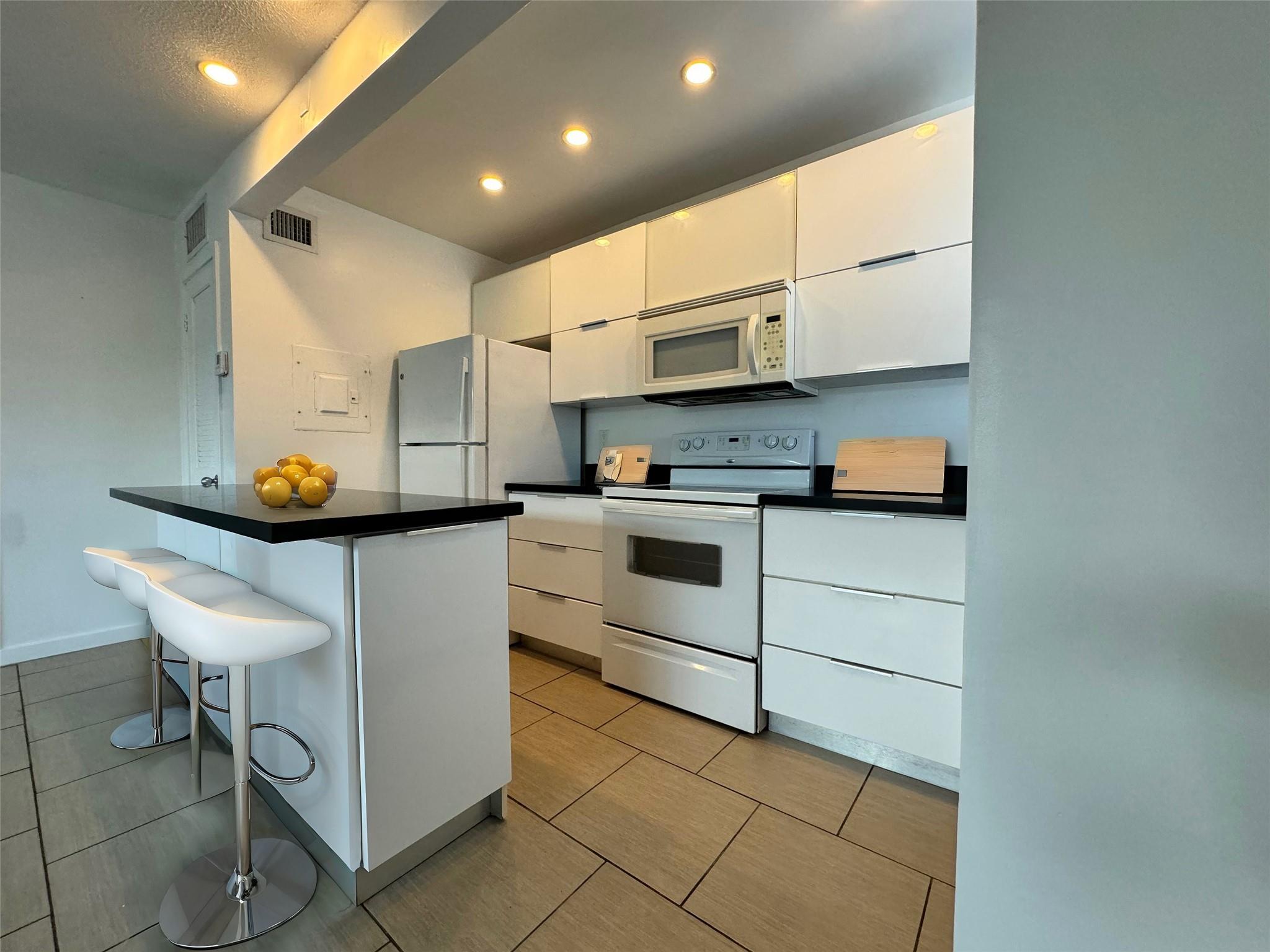 Come see this large, charming, modern one bedroom apartment. Features a sleek, open layout with a stylish sliding glass divider separating the sleeping and living areas. The bright, minimalist kitchen is equipped with white cabinetry and black countertops, offering plenty of space for cooking. The apartment also includes a spacious walk-in closet with ample shelving for storage. Ideal for those seeking a comfortable and practical living space with a clean and contemporary feel. First, last and $1,000 for SECURITY DEPOSIT!