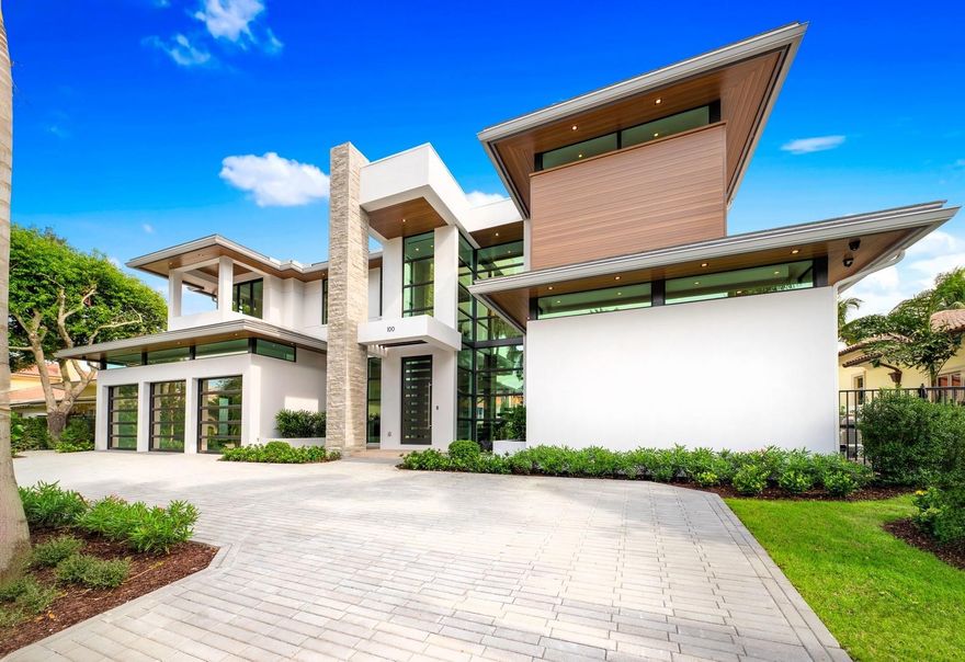 Introducing 100 Royal Palm Drive, a new construction modern masterpiece impeccably constructed with superior craftsmanship. Located on one of the widest, deepest canals on the Las Olas Isles, featuring underground utilities and spectacular long water views, all combining to make this the premier location to live on the Isles. This lavishly appointed estate features a first floor primary suite, for a total of 6 bedrooms, 6 baths, 2 half baths and a 3 car garage. Other features include a dedicated office, temperature controlled wine room, Club room with bar, commercial grade elevator, gas fire place, floating staircase, outdoor summer kitchen and bar, 48 KW generator, two fire bowls with waterfall features, new seawall and concrete dock, two dock pedestals with 100,50, and 35 amp service.