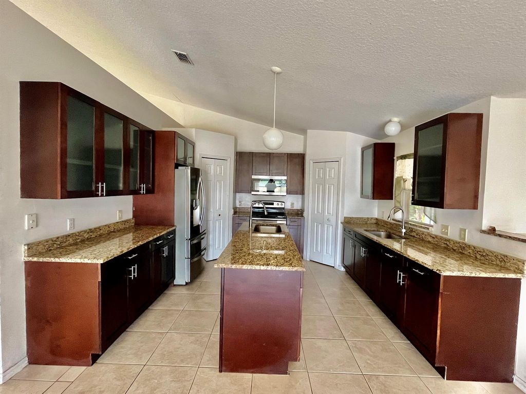 Photo of 4610 SW Dactyl Street, Port Saint Lucie, FL 34953 (MLS # R10968190)