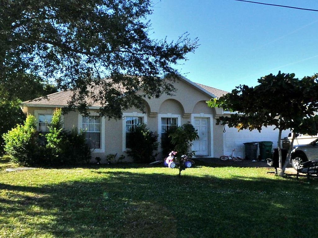 Photo of 4610 SW Dactyl Street, Port Saint Lucie, FL 34953 (MLS # R10968190)