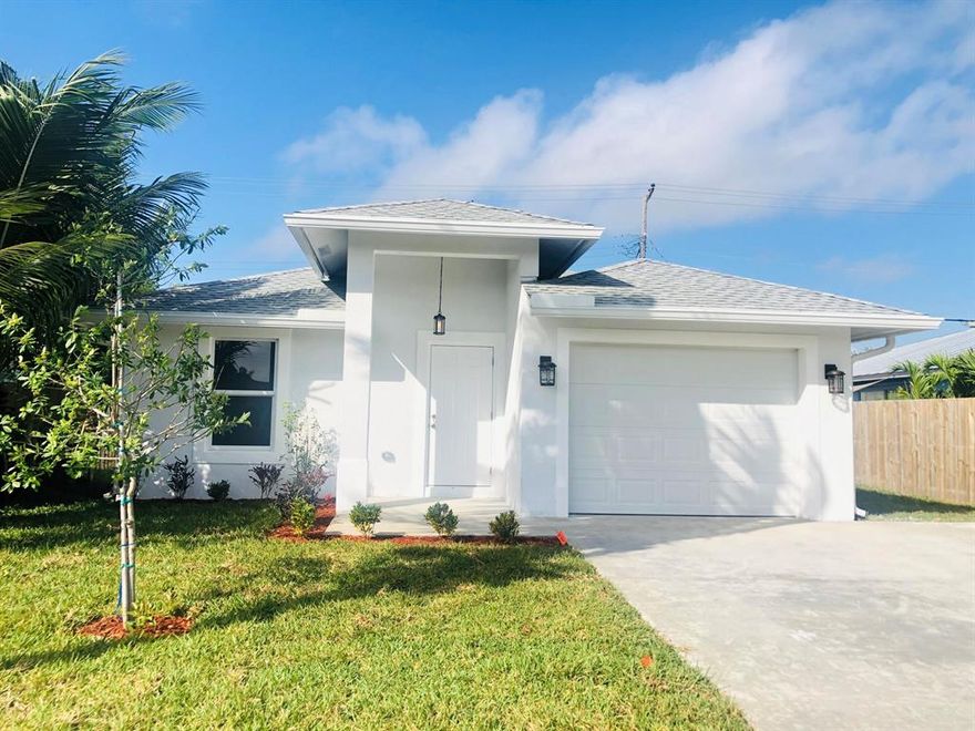 Gorgeous NEW CONSTRUCTION single family residence in the heart on Lake Worth, close to downtown Lake Worth, I-95, beaches, restaurants, and major shopping centers. The house boats a bright, open living area and kitchen with granite countertops, brand new stainless steal appliances, white wood cabinetry, and modern glass backsplash. The property also features wood plank tile flooring, dual sink bathrooms, shower/bath glass doors, impact doors and windows, automatic irrigation system, washer and dryer, and much more. Make this charming house yours today!