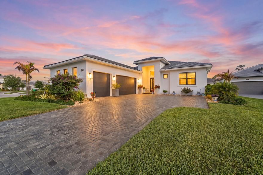 This luxury single family Florida home is thoughtfully designed for both peace of mind and buyers looking for high end finishes and functionality. Key features include impact windows and doors, whole house generator, Rinnai water heater, a saltwater pool with sun shelf, and a 3 car garage, providing security, comfort, and resort style living. Exterior upgrades include sealed paver driveway, pool and lanai, full home gutters, ADT exterior security cameras, and a metal fenced backyard with two gates. The pool is pre wired for a heater, and the lake fed sprinkler system supports efficient irrigation. HVAC is professionally serviced every six months.  Inside, the home offers 24" tile flooring throughout the main living areas and owner's suite, with upgraded carpet in secondary bedrooms. The foyer features a wood inlay ceiling with pendant lighting, setting a refined tone upon entry. The laundry room includes 42" cabinets, quartz countertops, and washer and dryer, ideal for full time or seasonal living. The three car garage is enhanced with epoxy flooring, built in cabinetry, attic storage decking, two dehumidifiers, and automatic garage door openers, making it ideal for vehicle storage, hobbies, or extended stays. Secondary bedrooms feature ceiling fans, walk in closets, custom silk blinds, and private ensuite bathrooms with frameless glass showers, ceiling height tile, quartz countertops, mirrors to the ceiling, and one piece Kohler toilets. A stylish half bath offers quartz countertops and a ceiling height mirror. Additional living spaces include a flex/bonus room—perfect for a home office or guest retreat—and a living room with electric fireplace, tile accent wall, recessed lighting, and TV wall mount. The owner's suite retreat features a tray ceiling, accent wall, and custom silk blinds, creating a tranquil private escape. This move in ready, low maintenance luxury home combines thoughtful upgrades, elegant design, and Florida lifestyle living—ideal for relocation buyers, second home owners, or full time residents.  HOA dues are paid until January 2027.