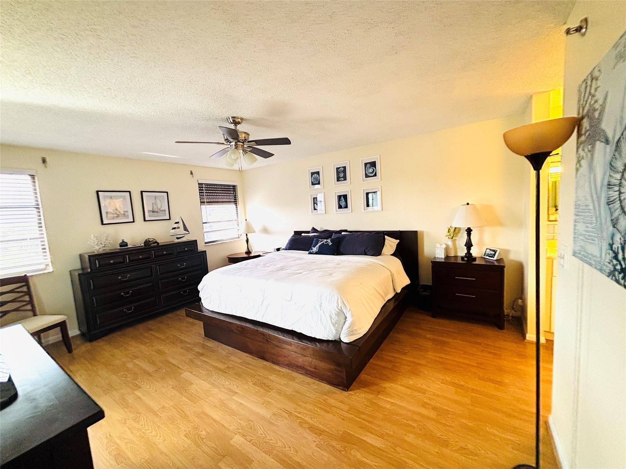 Experience resort-style living in this beautifully updated 2-bedroom, 2-bathroom condo, available for annual rental and fully furnished for your convenience. Located in a serene and well-maintained community, this bright and spacious unit offers breathtaking views of the lake and fountain from your private balcony – the perfect spot for morning coffee or evening relaxation. Modern, open-concept living space with stylish finishes throughout. The kitchen boasts updated appliances, sleek countertops, and ample storage. Both bedrooms are generously sized, with the primary suite featuring an en-suite bath and large closet. Enjoy peace of mind with in-unit laundry and access to community amenities.