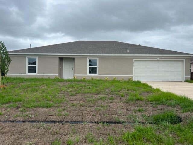 Photo of 4033 SW Mcintyre Street, Port Saint Lucie, FL 34953 (MLS # R10805832)
