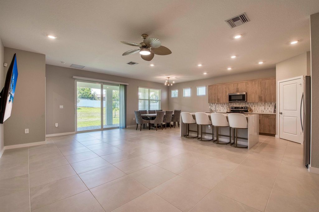 Photo of 1878 NE Ocean Dunes Drive, Jensen Beach, FL 34957 (MLS # R11100783)