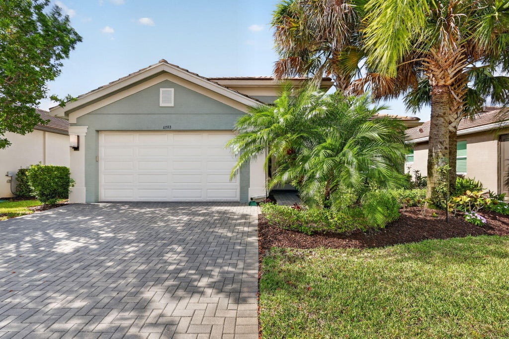 Photo of 11553 SW Half Moon Lake Lane, Port Saint Lucie, FL 34987 (MLS # B26058272)