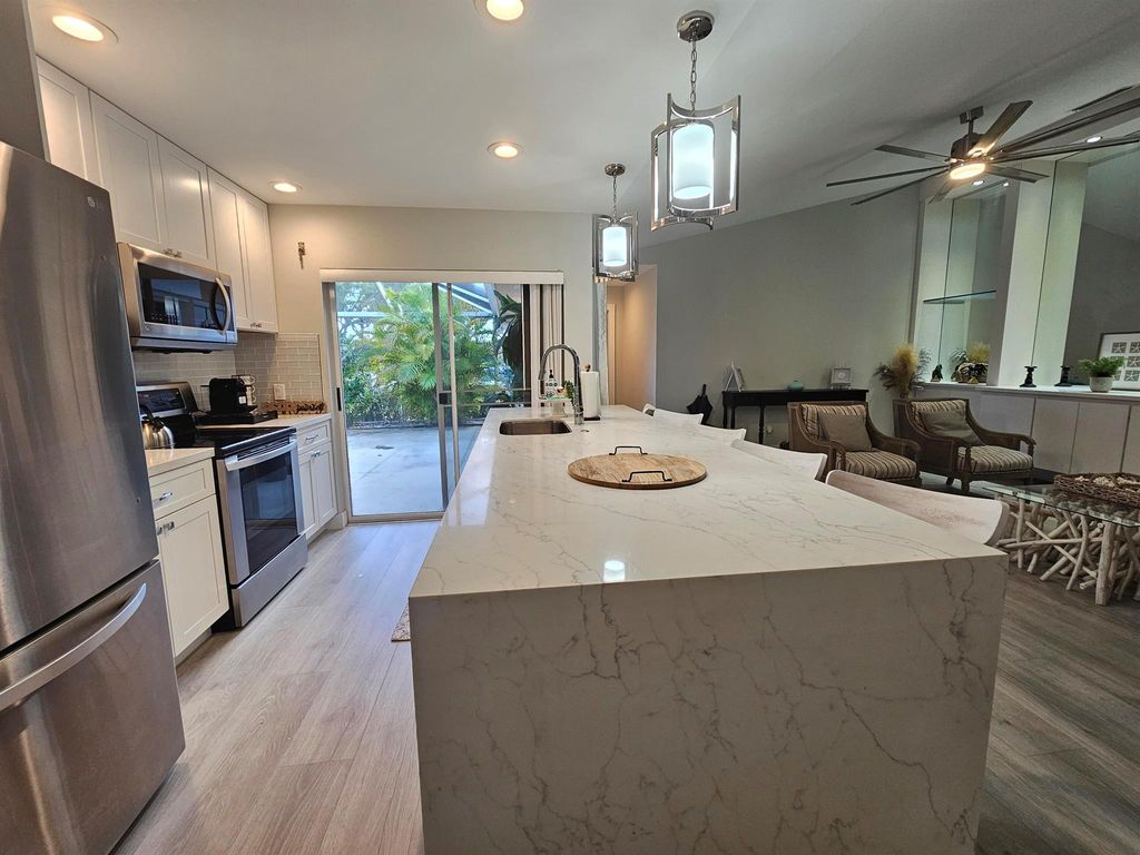 Photo of 3803 Ridgewood Drive, Palm Beach Gardens, FL 33403 (MLS # R10965116)