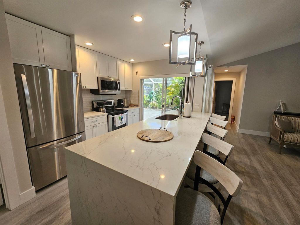 Photo of 3803 Ridgewood Drive, Palm Beach Gardens, FL 33403 (MLS # R10965116)