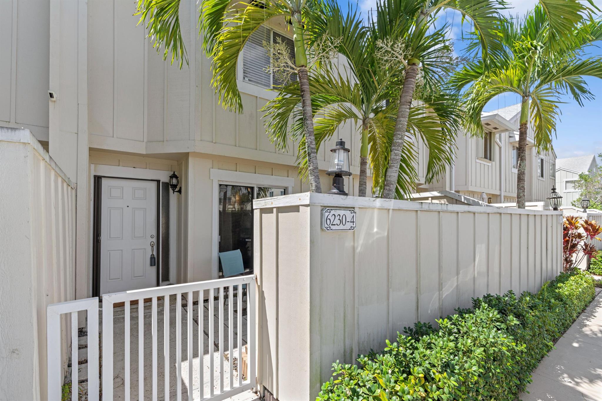 Well-priced and clean townhome in the highly desirable Jupiter community of Riverwalk. Gated front patio, and fenced-in back patio for entertaining and relaxing. Eat-in kitchen has ''granite'' counters and full-size washer and dryer in closet. All ceramic tile and wood laminate flooring, so great for kids or pets (No carpet). Two full master suites upstairs, including a balcony off the larger bedroom. All bathrooms have been updated. New roof in 2023. Community features: boat ramp, 3 swimming pools, playground, basketball, tennis, pickleball. Minutes from I-95, shopping, dining, beaches, entertainment. Enjoy paradise living at an affordable price!