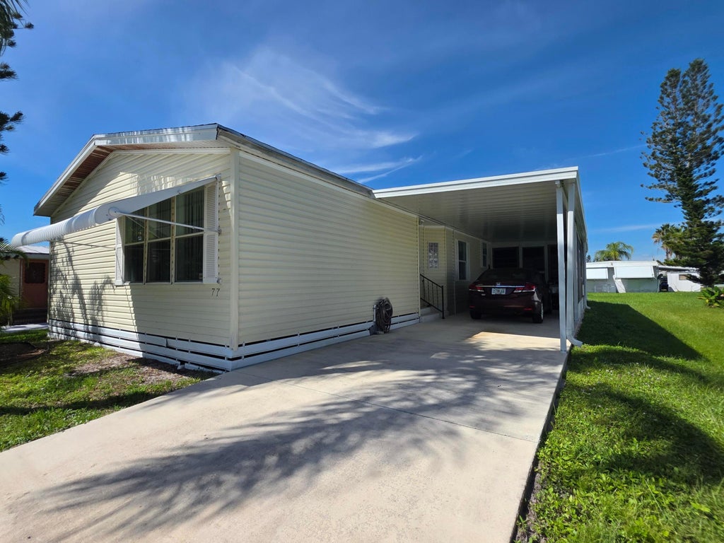 Photo of 77 Mediterranean Boulevard E, Port Saint Lucie, FL 34952 (MLS # B26083192)