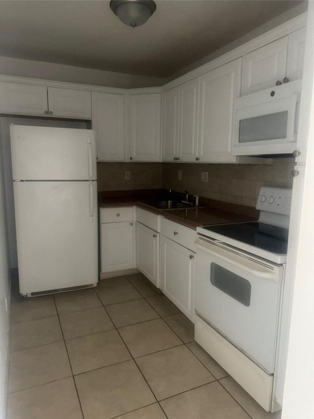 Photo of 1021 NW 45th Street #5, Deerfield Beach, FL 33064 (MLS # F10530055)