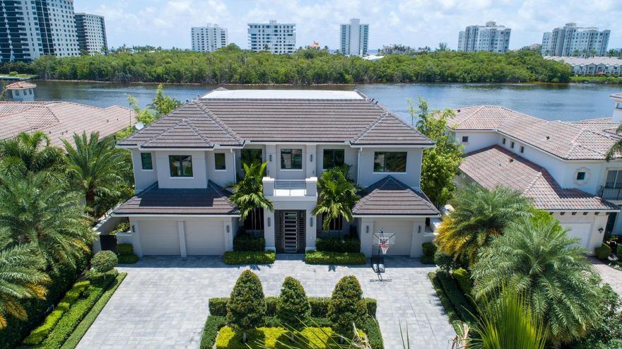 Sleek Transitional - Modern Intracoastal estate sited on 85 ± feet of waterfrontage on prestigious Boca Harbor Island with tranquil preserve views on the wide waterway.
A gated vestibule entry leads guests to the high-styled interiors with luxe slab porcelain floors, architectural ceilings, and window walls of glass.  A resort style entertainment patio features mosaic tiled pool /spa, expansive lanai with drop down screens, summer kitchen and 24K lb boat lift.
A 3-bay garage with boat storage room is also provided.  Show by appointment only. DISCLAIMER: Information published or otherwise provided by Premier Estate Properties, Inc. and its representatives including but not limited to prices, measurements, square footages, lot sizes, calculations and statistics are deemed reliable but are not guaranteed and are subject to errors, omissions or changes without notice. All such information should be independently verified by any prospective purchaser or seller. Parties should perform their own due diligence to verify such information prior to a sale or listing. Premier Estate Properties, Inc. expressly disclaims any warranty or representation regarding such information. Prices published are either list price, sold price, and/or last asking price. Premier Estate Properties, Inc. participates in the Multiple Listing Service and IDX. The properties published as listed and sold are not necessarily exclusive to Premier Estate Properties, Inc. and may be listed or have sold with other members of the Multiple Listing Service. Transactions where Premier Estate Properties, Inc. represented both buyers and sellers are calculated as two sales. Premier Estate Properties, Inc.'s marketplace is all of the following: Vero Beach, Town of Orchid, Indian River Shores, Town of Palm Beach, West Palm Beach, Manalapan Beach, Point Manalapan, Hypoluxo Island, Ocean Ridge, Gulf Stream, Delray Beach, Highland Beach, Boca Raton, East Deerfield Beach, Hillsboro Beach, Hillsboro Shores, East Pompano Beach, Lighthouse Point, Sea Ranch Lakes and Fort Lauderdale. Cooperating Brokers are advised that in the event of a Buyer default, no commission will be paid to a cooperating Broker on the Deposits retained by the Seller. No commissions are paid to any cooperating broker until title passes or upon actual commencement of a lease. Some affiliations may not be applicable to certain geographic areas. If your property is currently listed with another broker, please disregard any solicitation for services. Copyright 2020 Premier Estate Properties, Inc. All Rights Reserved.
