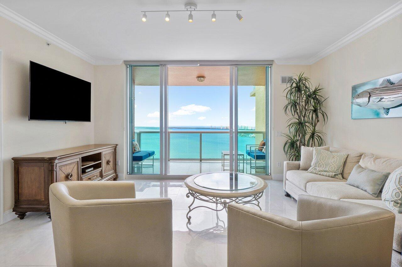 Panoramic 22nd floor Intracoastal & ocean views! Immaculate 2BR/2.5BA condo w/impact glass, Open concept w/spacious great room, dining/den, granite waterfall and backsplash in kitchen w/stainless appliance with split floor plan. Spacious owner suite w/his & her walk-in closets. Marble owner bath w/double vanity, jetted whirlpool bathtub & water closet. LED-lighted vanity mirrors in every bathroom. Neutral fresh paint and porcelain flooring throughout. Assigned parking, 24/7 manned gate, valet, tennis, pickleball, walking path w/gazebo, covered rooftop oasis w/pool, spa, BBQ areas, clubhouse, billiard room & fitness center. Marina w/dry docks available. Jump on your boat effortlessly & be on the ocean in minutes; no fixed bridges!