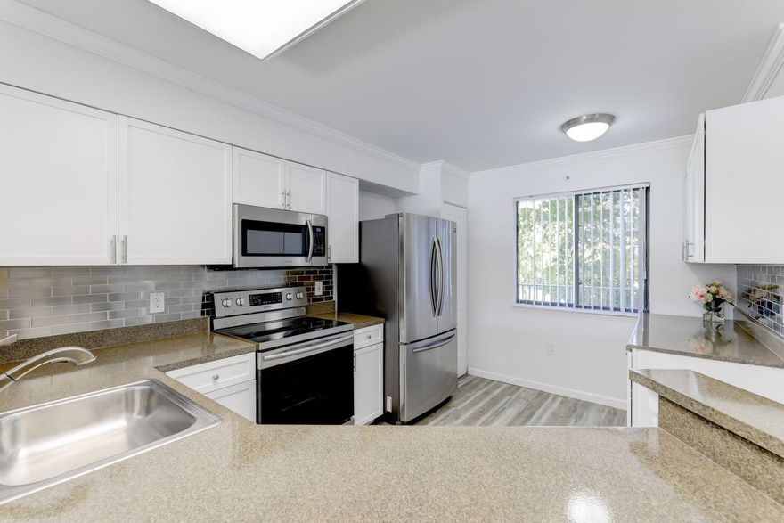 ABSOLUTELY BEAUTIFUL, ONE OF THE LARGEST 2/2 FLOORPLANS WITH DIRECT LAKE VIEW.  FULL RENOVATION JUST COMPLETED. NEW FLOORING THROUGHOUT, NEW KITCHEN ALL BRAND NEW STAINLESS STEEL APPLIANCES, BRAND NEW FRONT LOAD FULL SIZE WASHER & DRYER IN SEPARATE UNDER AIR LAUNDRY ROOM.  MASTER BEDROOM HAS MORE THAN ENOUGH ROOM FOR KING SIZE BEDROOM SUITE PLUS VERY LARGE WALK IN CLOSET WITH BRAND NEW DESIGNER CLOSET SYSTEM. NEW BATHROOM VANITIES, DESIGNER MIRRORS, NEWLY TILED CUSTOM BATHROOM SHOWERS.  NEW CROWN MOLDING AND BASEBOARDS THROUGHOUT.   RELAX OR ENTERTAIN ON YOUR LARGE SCREENED IN BALCONY WHILE ENJOYING THE BEAUTIFUL DIRECT LAKE VIEW.  ATTENTION TO EVERY DETAIL,      LITERALLY!  AMENITIES INCLUDE HEATED POOL, TENNIS, BASKETBALL COURTS,EXERCISE ROOM, TOT LOT, PICNIC AREA & CLUBHOUSE.