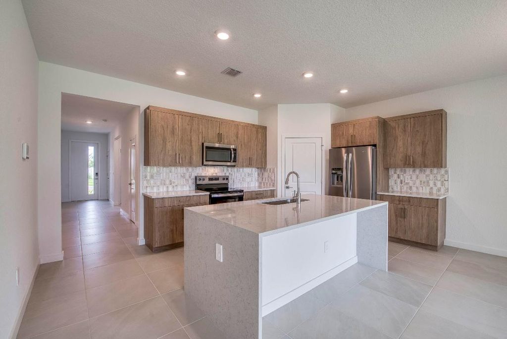 Photo of 2071 NE Cedar Street, Jensen Beach, FL 34957 (MLS # R11146061)