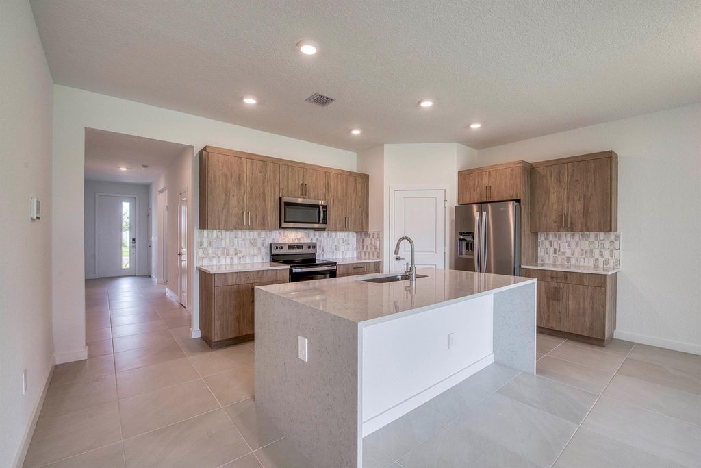 Photo of 2071 NE Cedar Street, Jensen Beach, FL 34957 (MLS # R11146061)