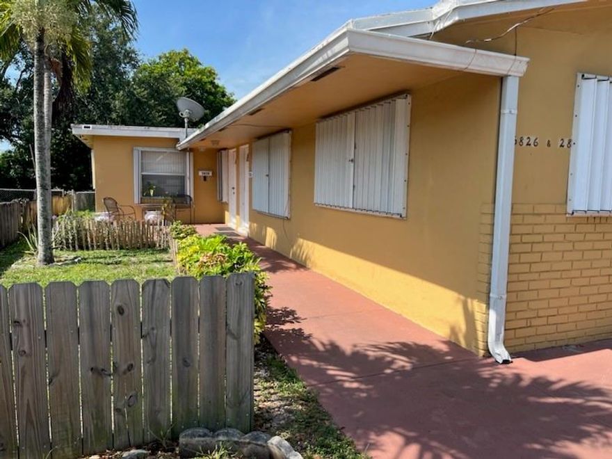 THIS IS A GREAT DUPLEX IN THE HOLLYWOOD AREA. THE FRONT UNIT HAS TWO BEDROOMS, WITH ONE BATHROOM, AND A LAUNDRY ROOM. THE BACK UNIT IS VERY LARGE - THREE BEDROOMS & TWO BATHROOMS, ALSO WITH A LAUNDRY ROOM. THERE ARE TWO SEPERATE ELECTRIC METERS. LARGE FENCED BACKYARD.
HURRICANE SHUTTERS. 

CENTRAL LOCATION - NEAR 441 & HOLLYWOOD BOULEVARD, RESTAURANTS, AND HOUSES OF WORSHIPS.