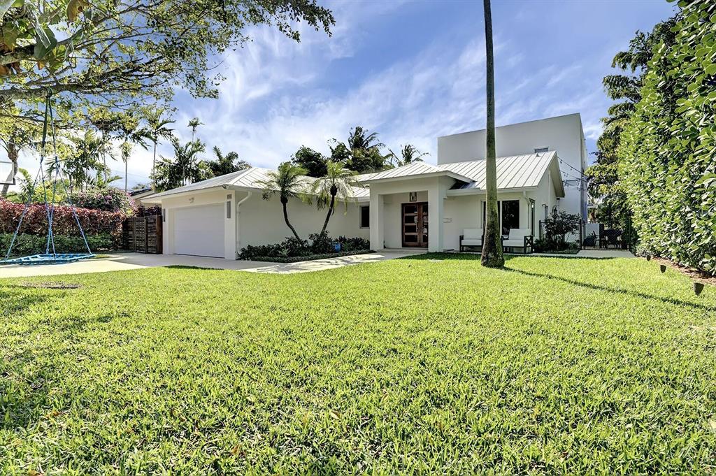 Waterfront! Spectacular modern coastal home on wide canal leading to Lake Ida. A large addition, along with an entire house and lot renovation, brings this home into the 2020's. SIX bedrooms, 5 1/2 modern designer baths, 2 master suites, chef's kitchen with Wolf gas stove, wood flooring throughout & soaring impact glass windows & doors are just some of the outstanding features. Relax on multi level patios and decks overlooking the water & large heated salt water pool with spa. Entire 2nd story has just been completed, and has never been lived in. Upstairs master with views of the water, features 2 walk-in closets, a bath with dual sinks & a separate soaking tub overlooking the lush landscaping. Convenient gated side parking pad for boat or RV. No HOA. Located in the Lake Ida Neighborhood