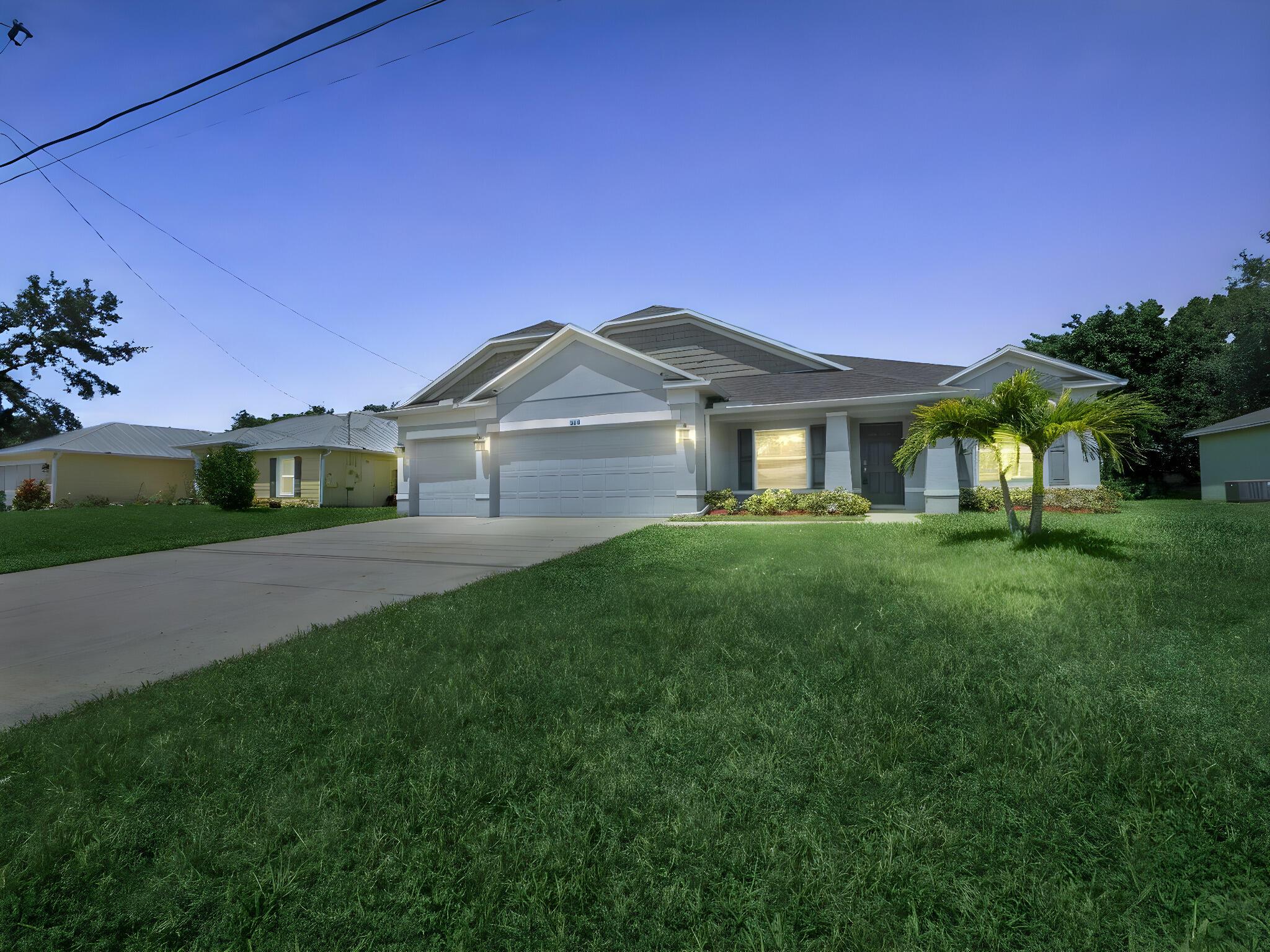 Welcome to this beautifully crafted 4-bedroom, 3-bathroom + Flex Room and 3 car garage CBS home, built in 2022 and thoughtfully designed for modern living. Located in a desirable Port St. Lucie neighborhood, this custom residence features a spacious split-floor plan with a large great room perfect for entertaining and everyday comfort. The open-concept kitchen is a chef's dream, complete with solid surface countertops, ample cabinetry, and a functional layout that flows seamlessly into the living and dining areas. A versatile den offers the ideal space for a home office, media room, or guest retreat. Enjoy the elegance of extensive ceramic tile flooring throughout the main living spaces, adding both style and easy maintenance.
