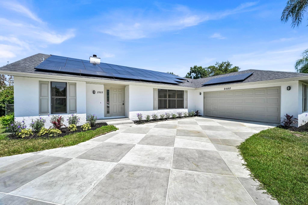 Photo of 2582 SW Mcdonald Street, Port Saint Lucie, FL 34953 (MLS # B26040700)