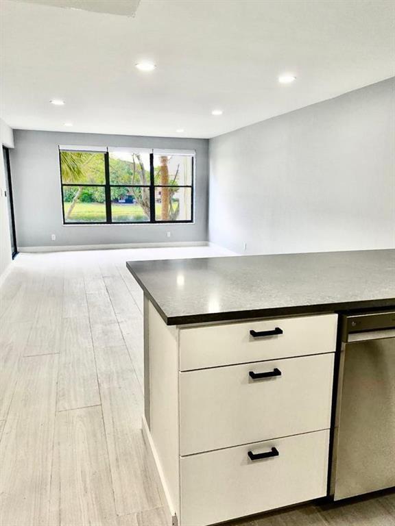 Photo of 2322 S CYPRESS BEND Drive #210, Pompano Beach, FL 33069 (MLS # B26076778)