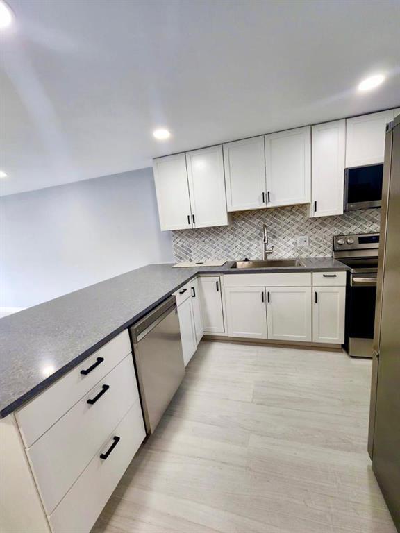Photo of 2322 S CYPRESS BEND Drive #210, Pompano Beach, FL 33069 (MLS # B26076778)