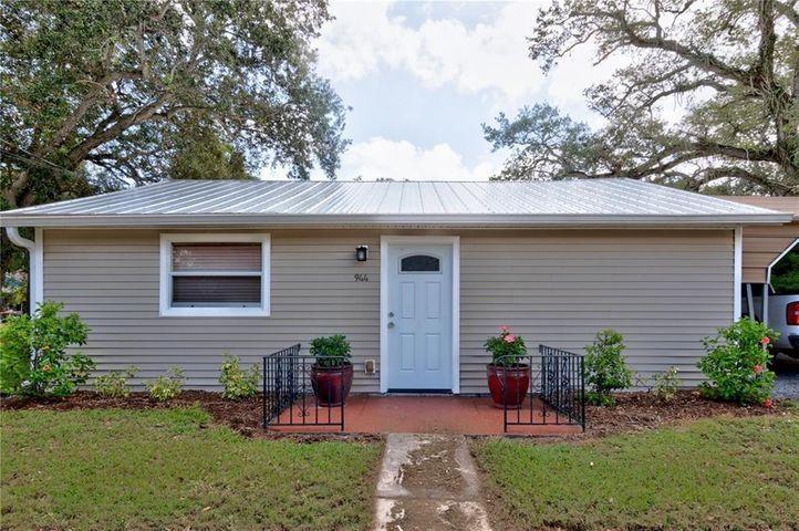 Quint two bedroom home w/carport, in a peaceful setting surrounded by tall oak trees and lush landscaping in the heart of Sebastian. Home comes with a Newer Metal Roof, tile floors, central A/C , cherry wood cabinets, stainless steel appliances , washer and dryer inside home. Private patio in back. rent includes water and septic , just a short walk to Sebastian's Riverfront.