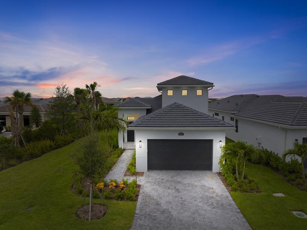 Immaculate Kolter-built 4BR/3BA home + a den in desirable PGA Verano! This spacious, open-concept layout features a large kitchen island overlooking a bright, airy living area, perfect for entertaining. Enjoy tranquil lake views from the screened-in patio, with no neighbors to the right for added privacy. Located just minutes from shopping in Tradition, Publix, and I-95. Rent INCLUDES HOA fee and access to incredible amenities: resort-style pool, pickleball, tennis courts, fitness center, clubhouse, and a manned gated entrance. Cable, landscape maintence, lawn care, internet, and alarm system are included. Don't miss this move in ready gem!