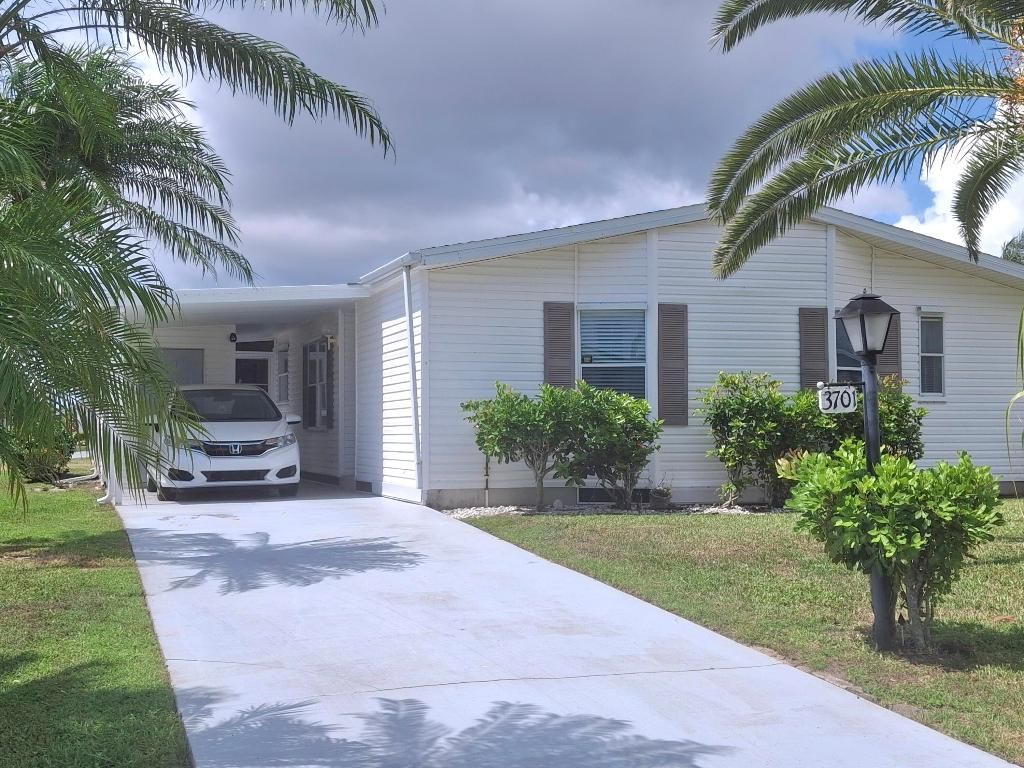 Photo of 3701 Sleepy Hollow Lane, Port Saint Lucie, FL 34952 (MLS # R11099632)