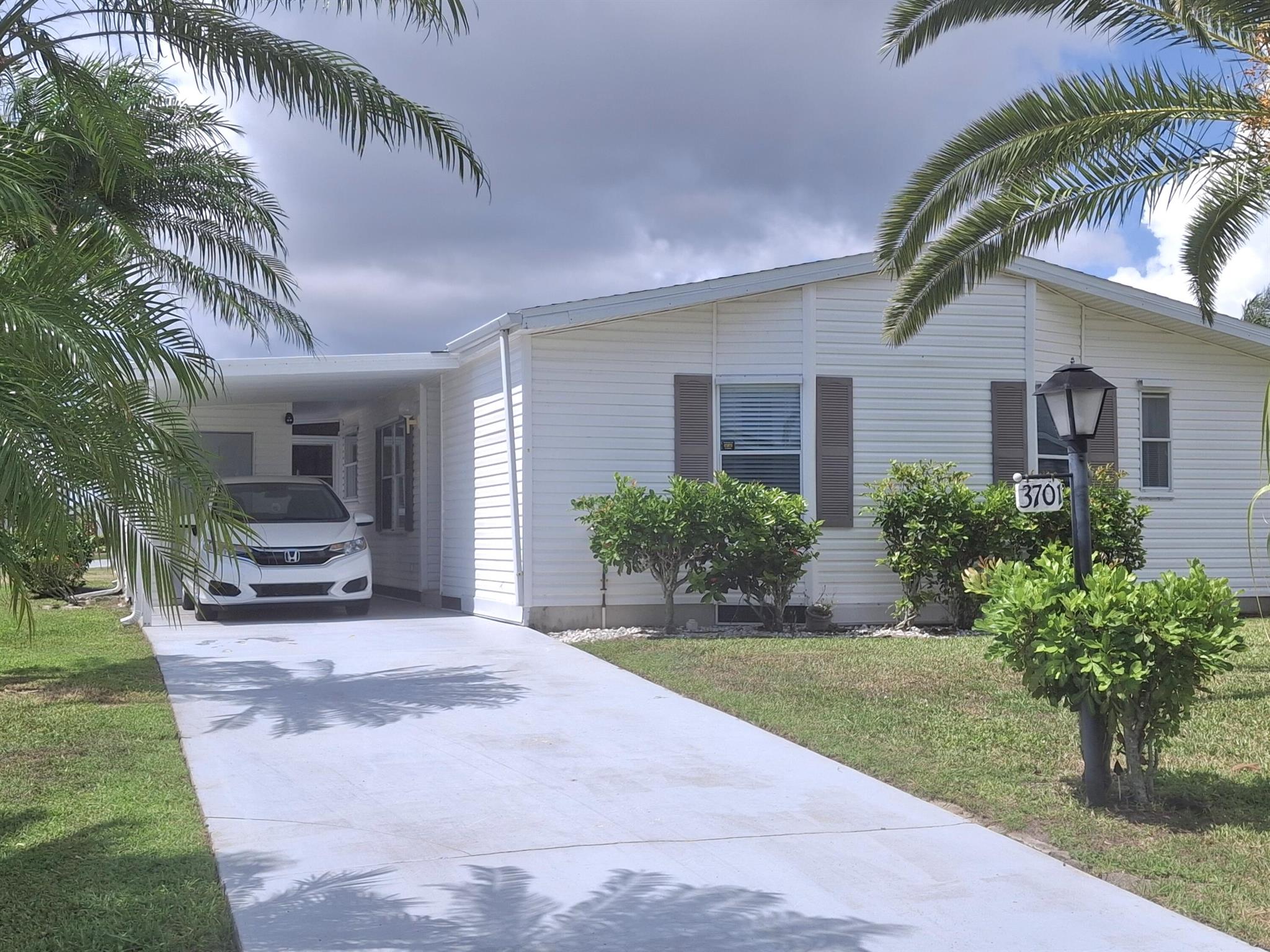 One of the best deals in Savanna Club for the price! 2/2 with a lanai on a quiet street. Roof 2024 Primary bedroom can fit a king sized bed. An outdoor patio on the back of the home to enjoy grilling outdoors. Open living and formal dining area with a dinette area off the kitchen. This home has fabulous tropical landscaping with all the palm trees. Come and view this house and make it your home. Savanna club has 3 clubhouses, 3 pools, 3 exercise rooms with modern equipment, a theater and an on-site restaurant. Pickleball, tennis, cornhole, shuffle board and bocce are just a few of the numerous activities to enjoy. There are also a great many clubs to join as well. Be as busy as you want to be. Within minutes to physicians, hospital and beaches.