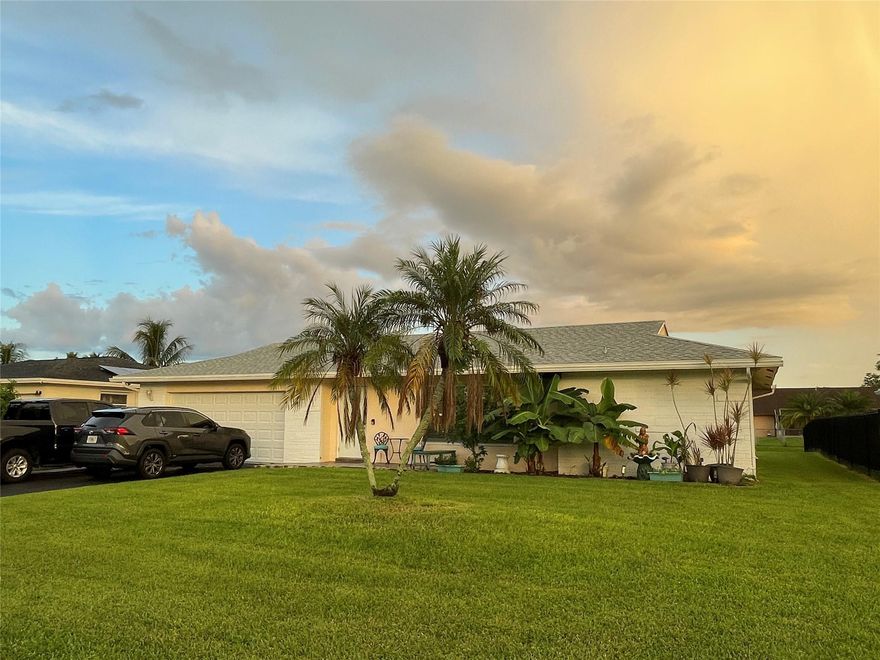 New roof and hurricane-impact windows and doors. Four-point inspection completed in 2025. Air conditioner and hot water heater recently updated. Kitchen, bathrooms, trim, flooring, lighting, and plantation shutters have all been remodeled. This waterfront home features 3 bedrooms, 3 full bathrooms, and a 2-car garage. The open-concept layout provides abundant natural light and offers wide canal views through large impact windows and sliding glass doors. Located close to the community pool. Walking distance from Publix and the community parks to watch fireworks! The property combines modern updates with a tranquil waterfront setting.