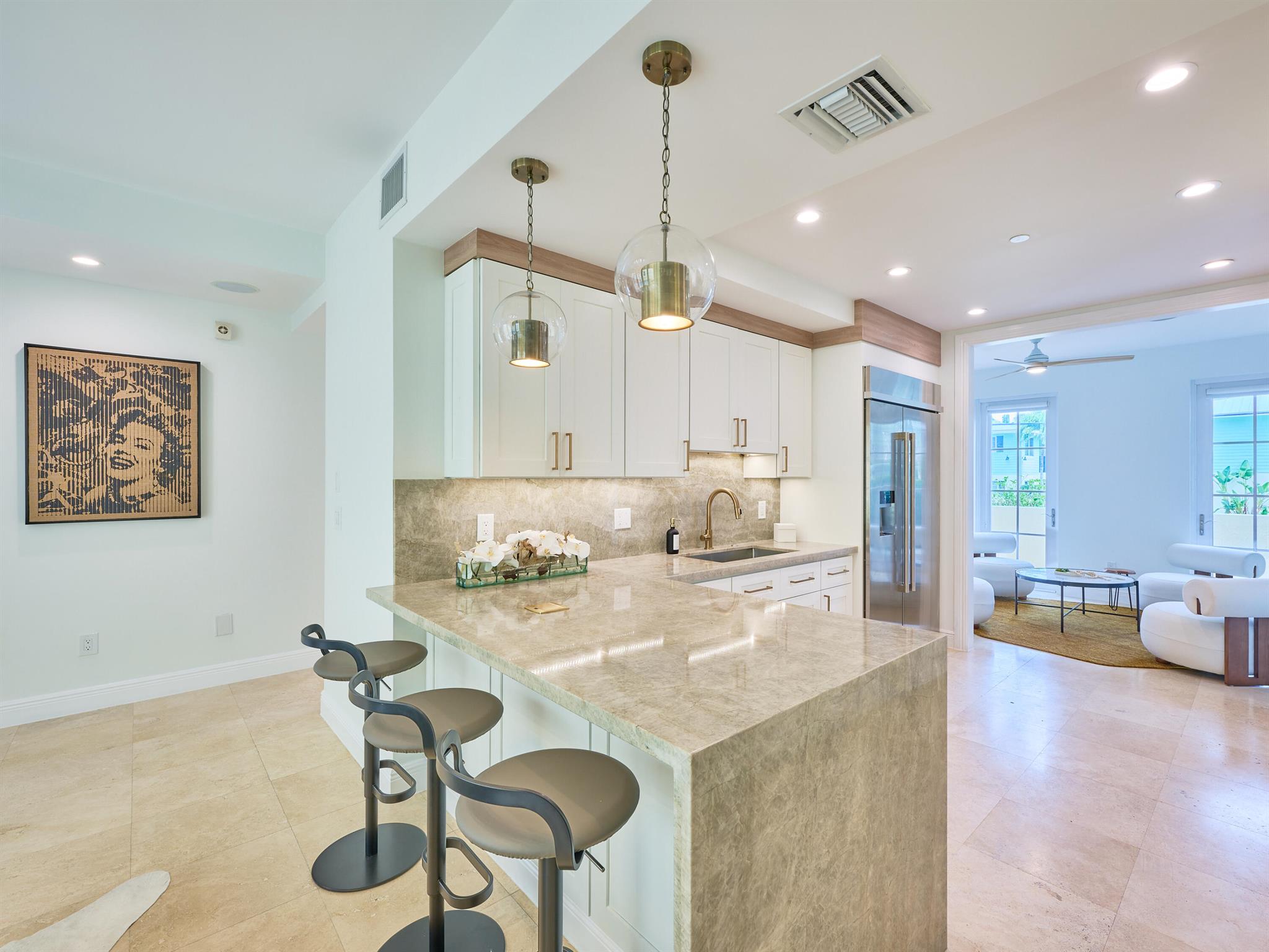 Explore unparalleled townhome living at Terraces at Delray! Own a distinctive townhome in a prime A+ location with meticulous property care provided by the HOA, covering landscaping and pool maintenance. Recently renovated, this property boasts fresh paint inside and out, a modern kitchen with new white cabinets with beautiful gold hardware, quartz countertop, and stainless steel appliances. The redesign includes a modern staircase and various enhancements.Luxuriate in this oversized 4-bed, 4.5-bath townhouse spanning over 3600 sqft under air. The layout features a private courtyard, pool, two-car garage, ensuite bathrooms, an elevator, and a spacious rooftop terrace. This impeccably renovated property embodies refined living. Seize the opportunity to make it yours!