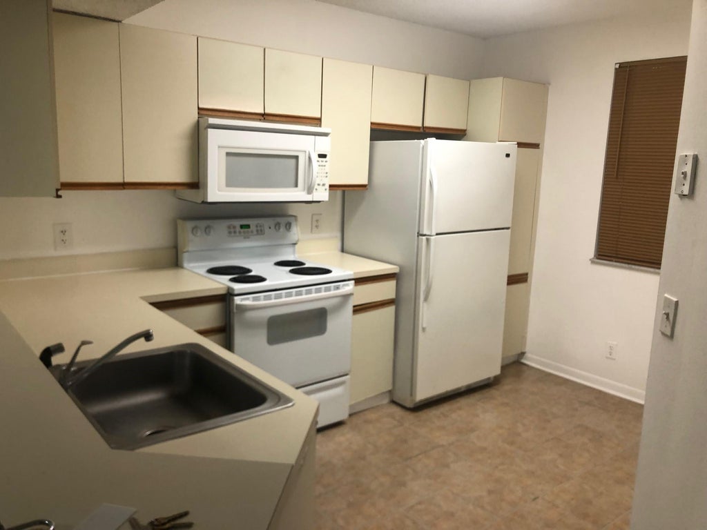 Photo of 8781 WILES Road #201, Coral Springs, FL 33067 (MLS # B26068967)