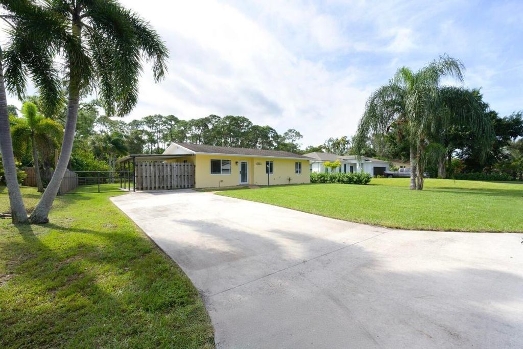 Photo of 6144 SE Orange Blossom Trail, Hobe Sound, FL 33455 (MLS # R11030739)