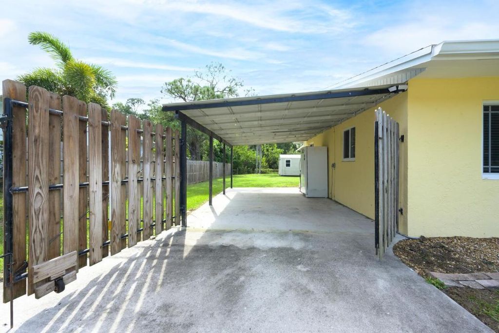 Photo of 6144 SE Orange Blossom Trail, Hobe Sound, FL 33455 (MLS # R11030739)