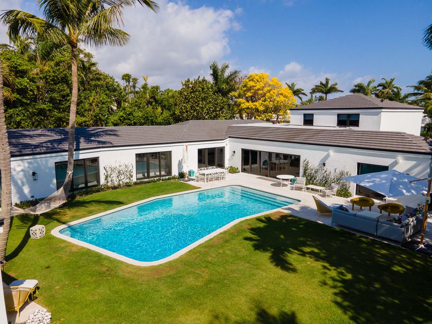 Stunning 5BR/5.2BA Mid-Century Modern home beautifully renovated in 2020. Situated on 17,800 +/- square foot lot in the North End. Gourmet chef's kitchen with oversized island and top-of-the-line appliances overlooks outdoor dining area. Serene outdoor spaces with large pool and patio perfect for entertaining. Expansive Owner's wing with sitting room, beautiful bath, and dual walk-in closets. Additional highlights include library, wet bar, and second floor playroom that doubles as a fantastic guest suite. Convenient front and rear driveways.