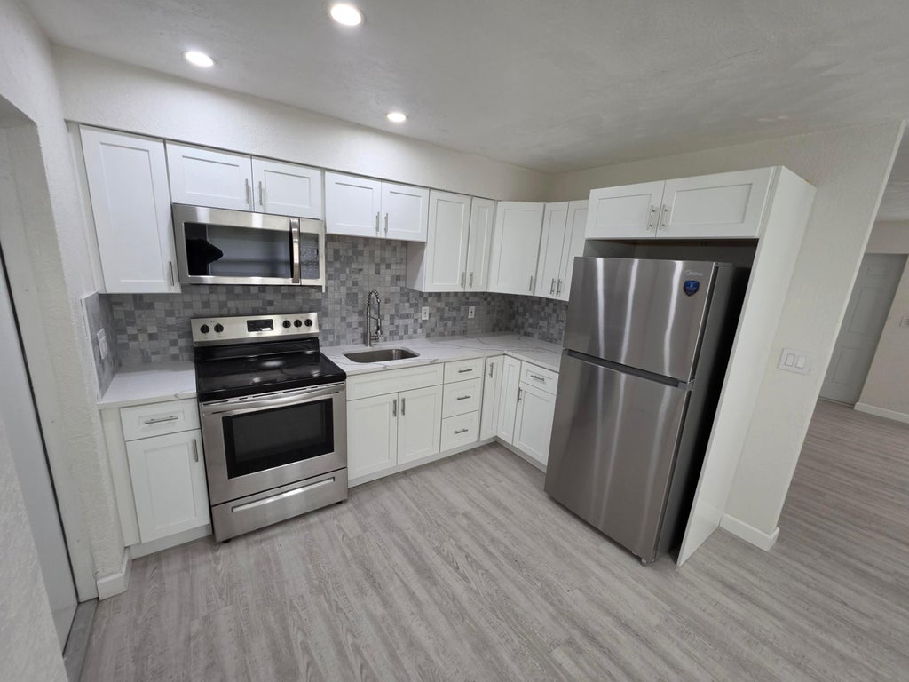 Photo of 1235 NW 5TH Ave #1-2, Fort Lauderdale, FL 33311 (MLS # B26080307)