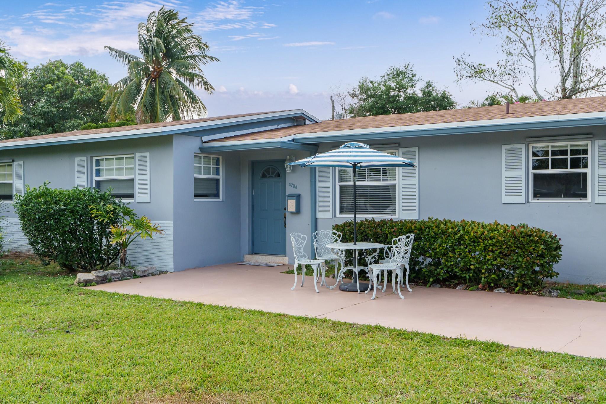 Super clean 3 bed, 2 bath 1 car garage (epoxy floor) home upgraded in 2023 with a new roof & gutters as well as a new Carrier AC in 2024. Complete storm protection will provide you with peace of mind this summer~ This home has a fantastic floor plan with an open kitchen, spacious Florida room, Primary Bedroom with en-suite bath, screened in back porch/patio & a terrific open front porch to enjoy with a cool drink while you visit with friends/neighbors after a long day. Nestled onto a lushly landscaped & expansive lot, with a refreshing above ground pool & built in charcoal grill, there's a lot of room to relax & entertain in this beauty. Sprinkler system on a well saves you $$! Polished terrazzo floors in the main living area. Natural gas available & transferable Termite Warranty too.