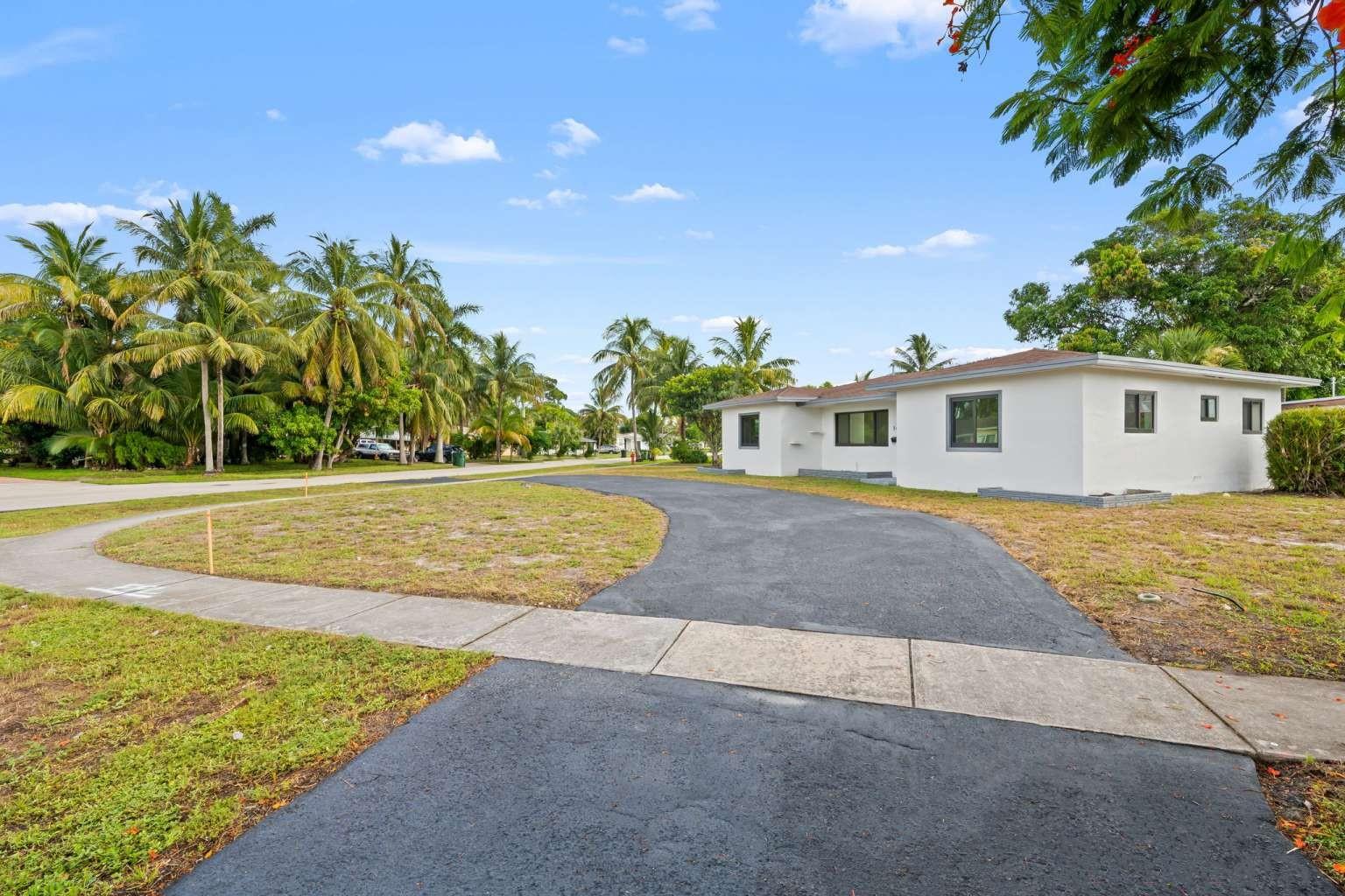 Stunningly remodeled 3-bedroom, 2-bath home on an oversized corner lot in the heart of Fort Lauderdale. This spacious residence boasts a deep garage, a brand-new kitchen with stainless steel appliances and quartz countertops, elegantly updated bathrooms, and luxury vinyl flooring throughout. Enjoy peace of mind with newer impact windows and doors, a 2021 roof, a new A/C system, and a new hot water tank. Fresh paint inside and out, modern fixtures throughout, and a large fenced backyard complete this move-in-ready gem.