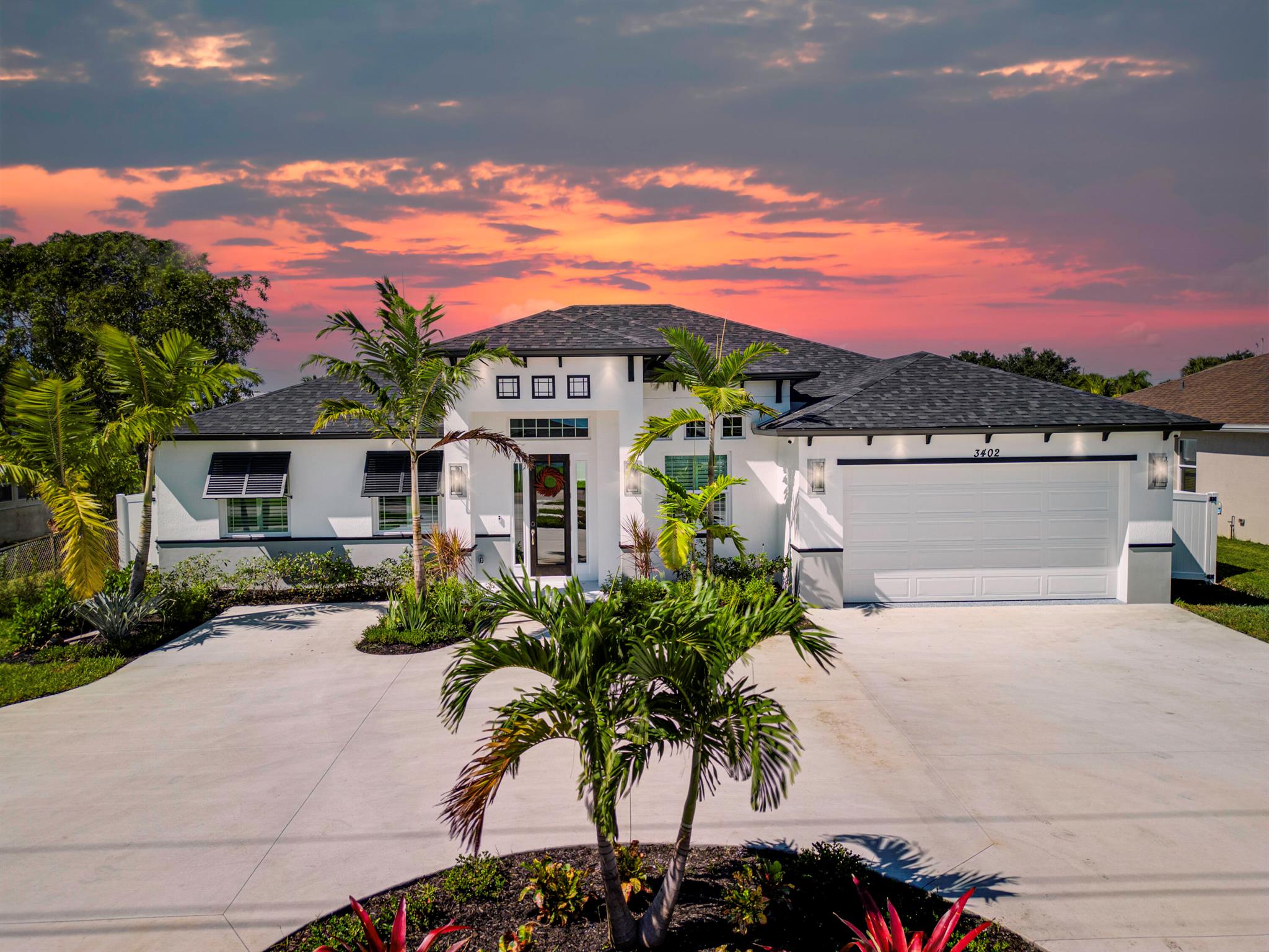 This Builder Model is sold fully furnished with designer-selected furniture & decor, plus $100K+ in luxury upgrades; move in and live the dream from day one! Featuring 4BR/3BA + den, 11'4'' ceilings with tall doors, and a show-stopping wood-stained octagon coffer. The chef's kitchen wows with Cambria quartz, black stainless appliances, wall oven + hood, reverse osmosis, and a spacious walk-in pantry. Elegant details include wood plank tile, impact windows with plantation shutters, barn doors, shiplap fireplace with mantle, dry bar, cabana bath, and epoxy-finished garage. Outdoors, enjoy a fire pit, covered patio, lush fenced 1/4 acre lot, and a circular driveway for curb appeal that stuns. A rare, one-of-a-kind opportunity!