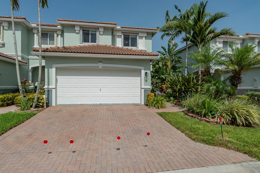 Photo of 2146 OAKMONT Drive, Riviera Beach, FL 33404 (MLS # B26073571)